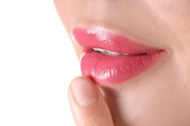 Photo of Woman with beautiful pink lipstick on her lips against white background, closeup