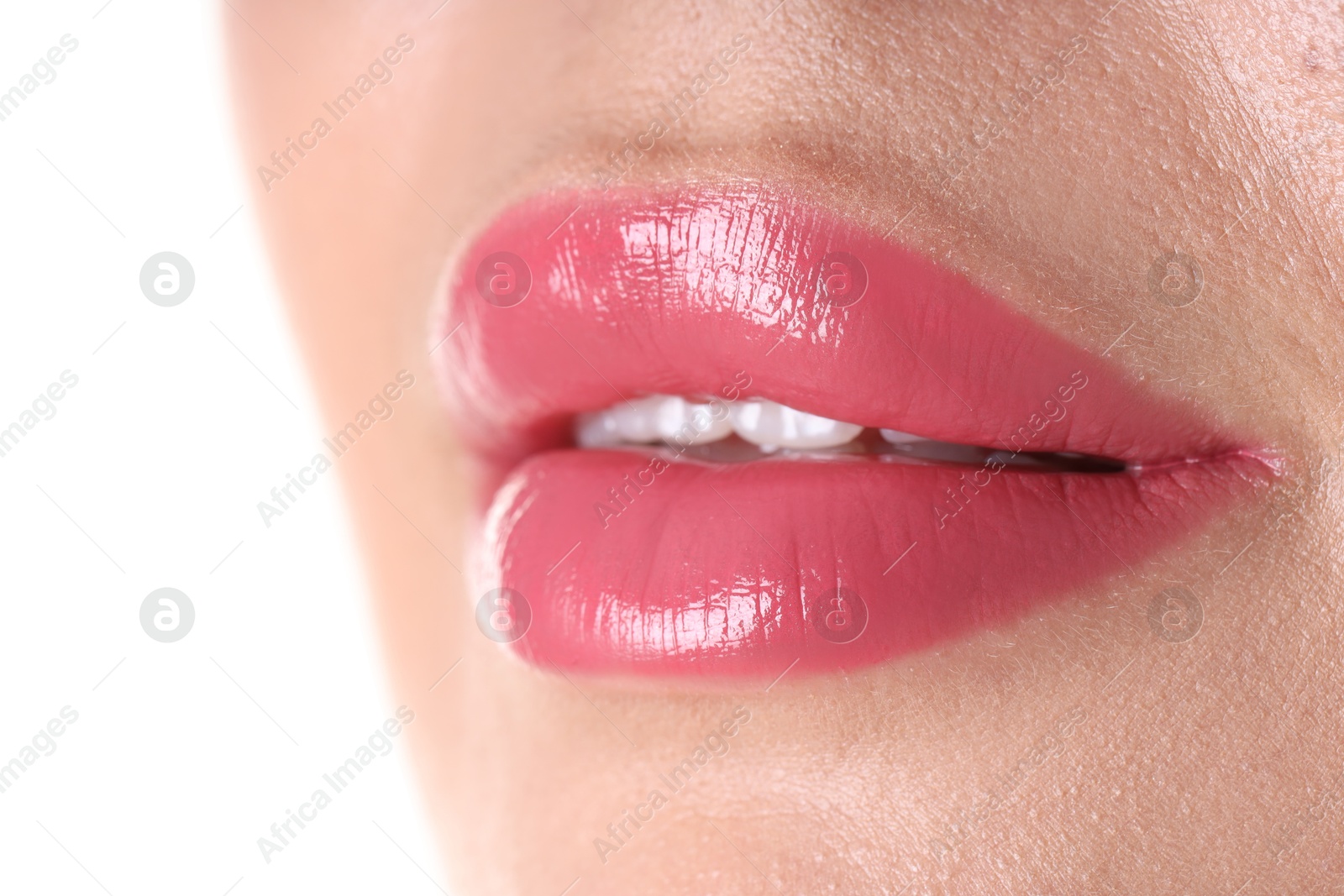 Photo of Woman with beautiful pink lipstick on her lips against white background, closeup
