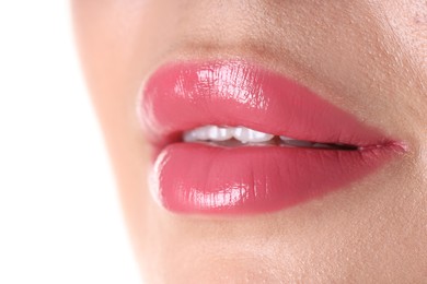 Photo of Woman with beautiful pink lipstick on her lips against white background, closeup