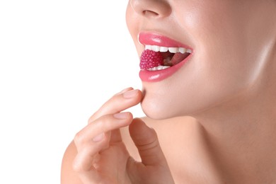 Photo of Woman with beautiful pink lipstick on her lips and raspberry candy against white background, closeup