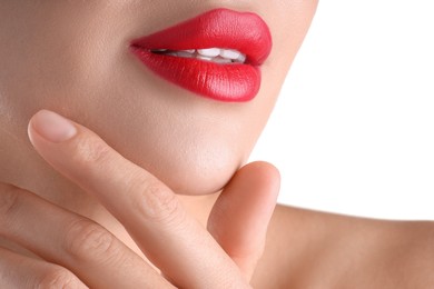 Photo of Woman with beautiful red lipstick on her lips against white background, closeup