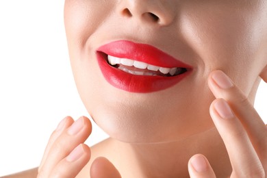 Photo of Woman with beautiful red lipstick on her lips against white background, closeup