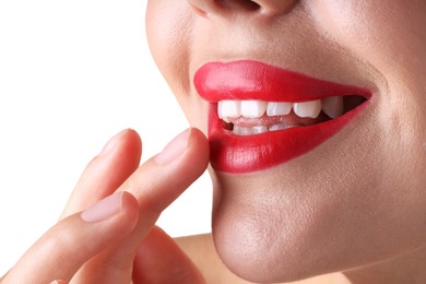 Photo of Woman with beautiful red lipstick on her lips against white background, closeup