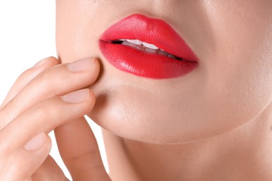 Photo of Woman with beautiful red lipstick on her lips against white background, closeup