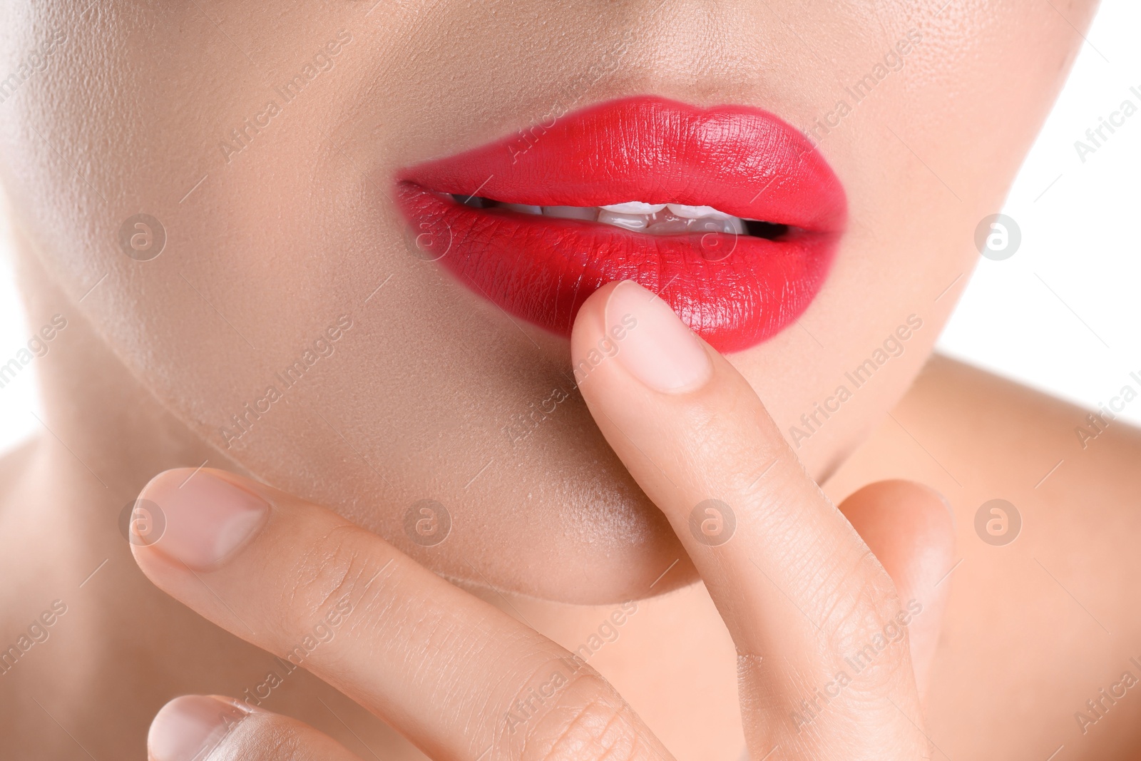 Photo of Woman with beautiful red lipstick on her lips against white background, closeup