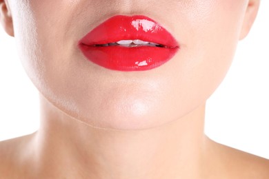 Photo of Woman with beautiful red lipstick on her lips against white background, closeup