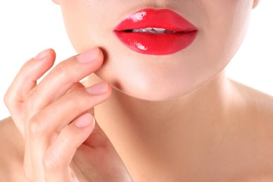 Photo of Woman with beautiful red lipstick on her lips against white background, closeup