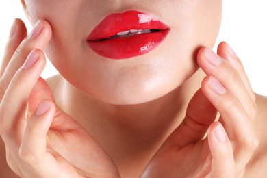 Photo of Woman with beautiful red lipstick on her lips against white background, closeup