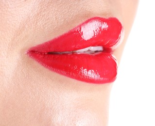 Photo of Woman with beautiful red lipstick on her lips against white background, closeup