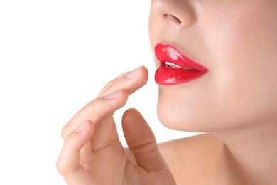 Photo of Woman with beautiful red lipstick on her lips against white background, closeup