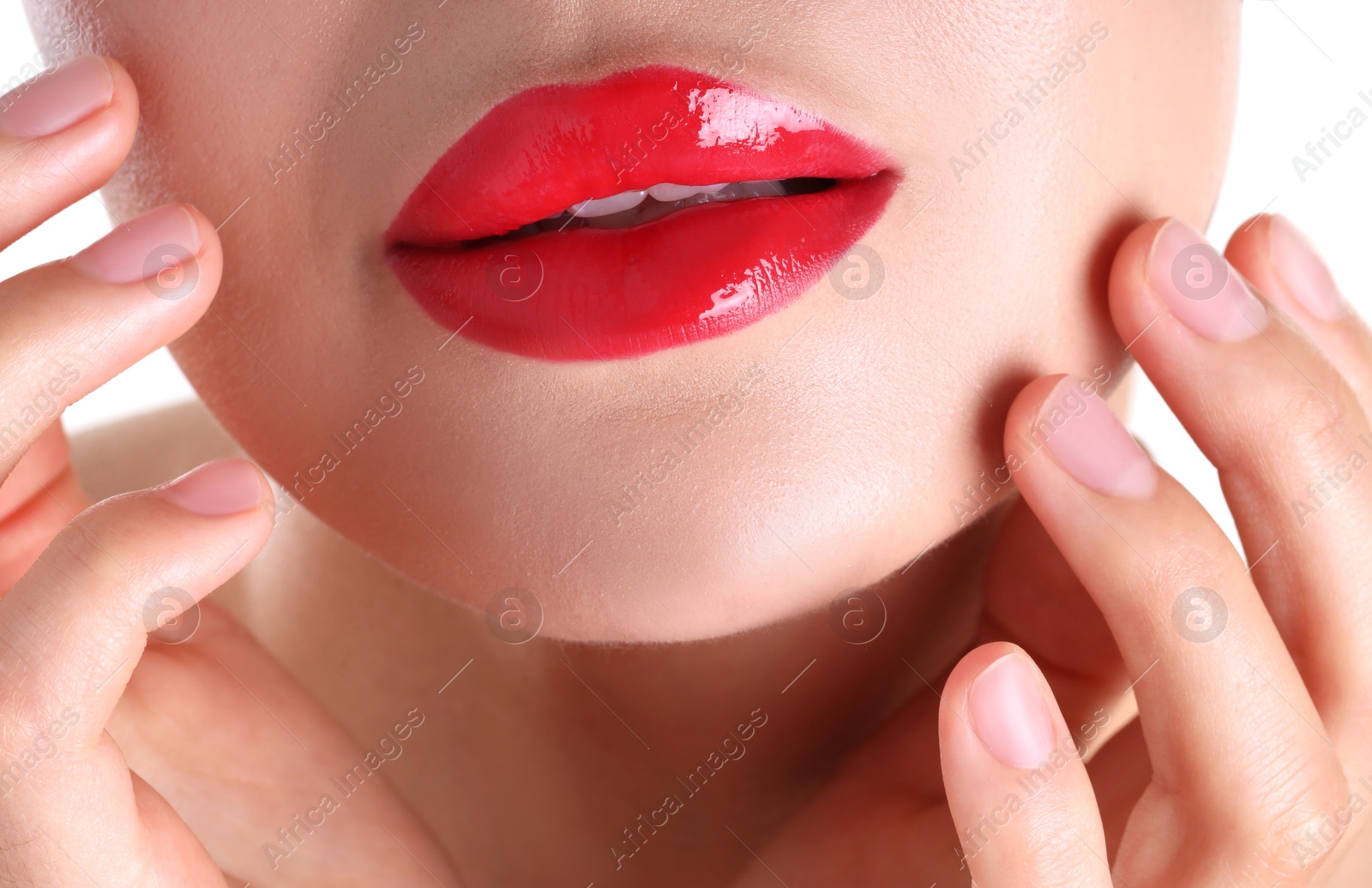 Photo of Woman with beautiful red lipstick on her lips against white background, closeup
