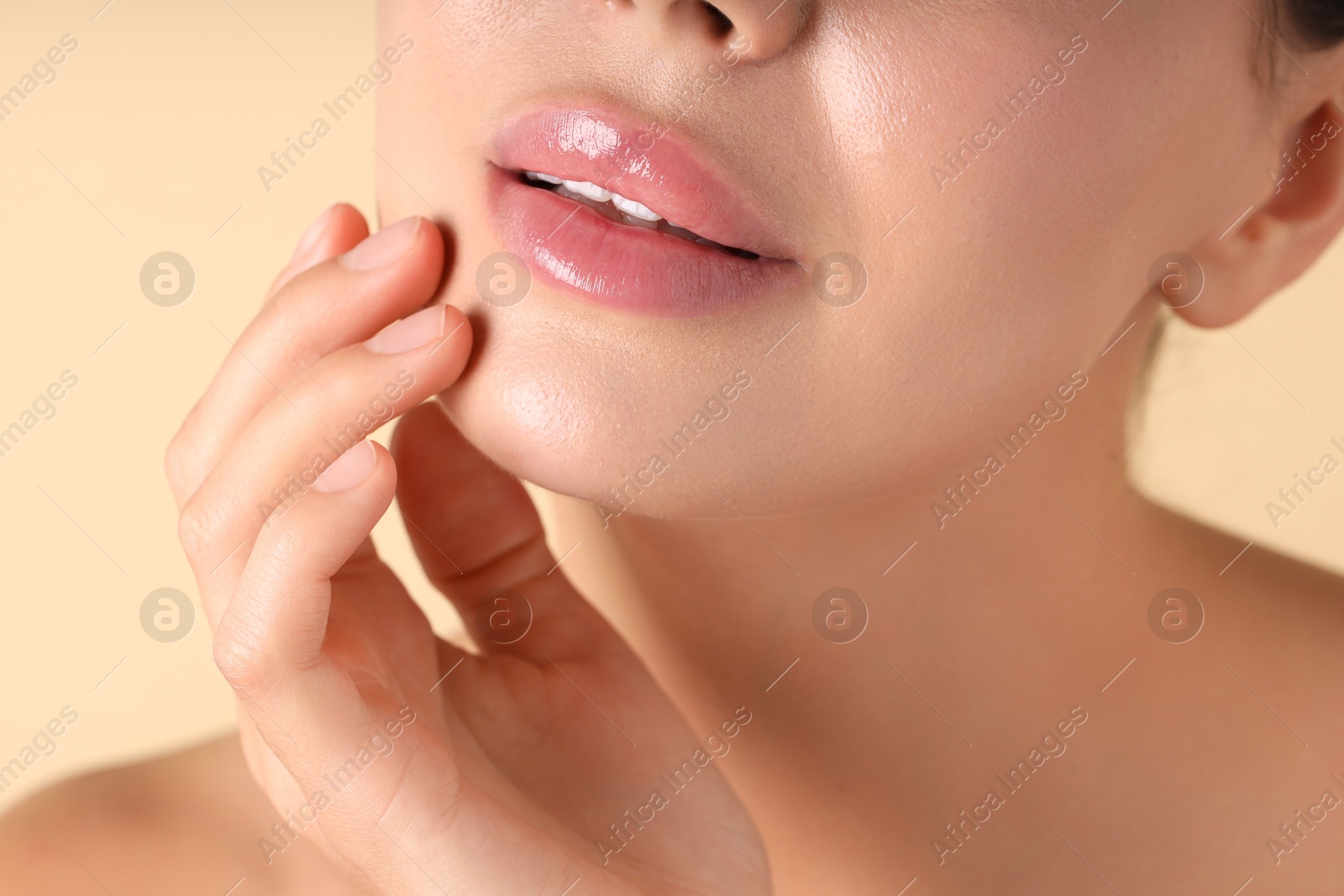 Photo of Woman with beautiful lips on beige background, macro view