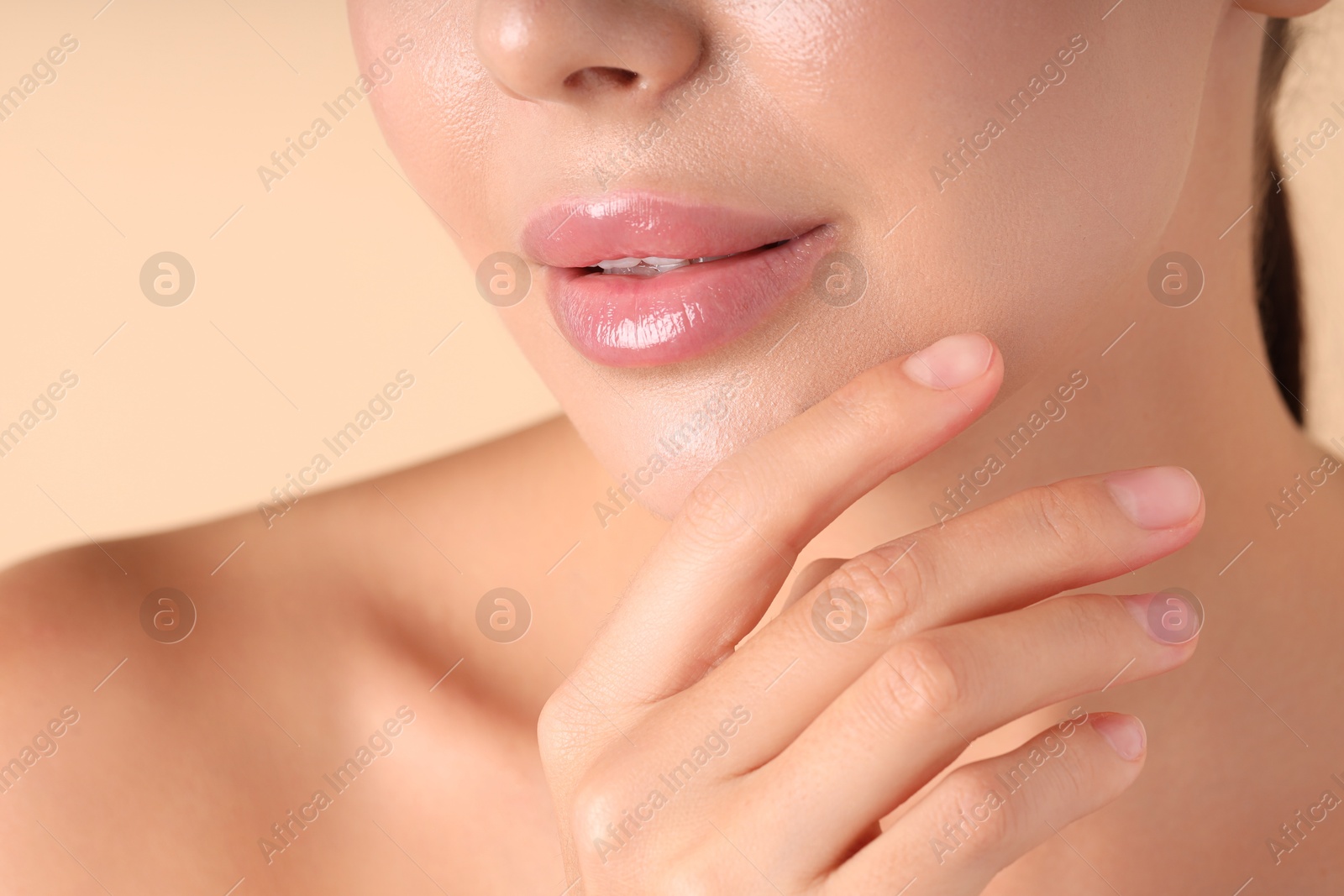 Photo of Woman with beautiful lips on beige background, macro view