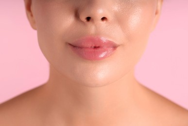 Photo of Woman with beautiful lips on pink background, macro view