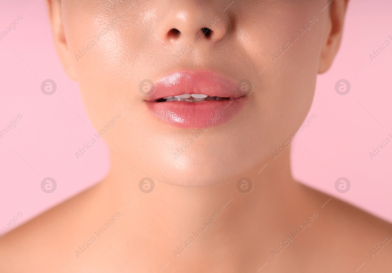 Photo of Woman with beautiful lips on pink background, macro view