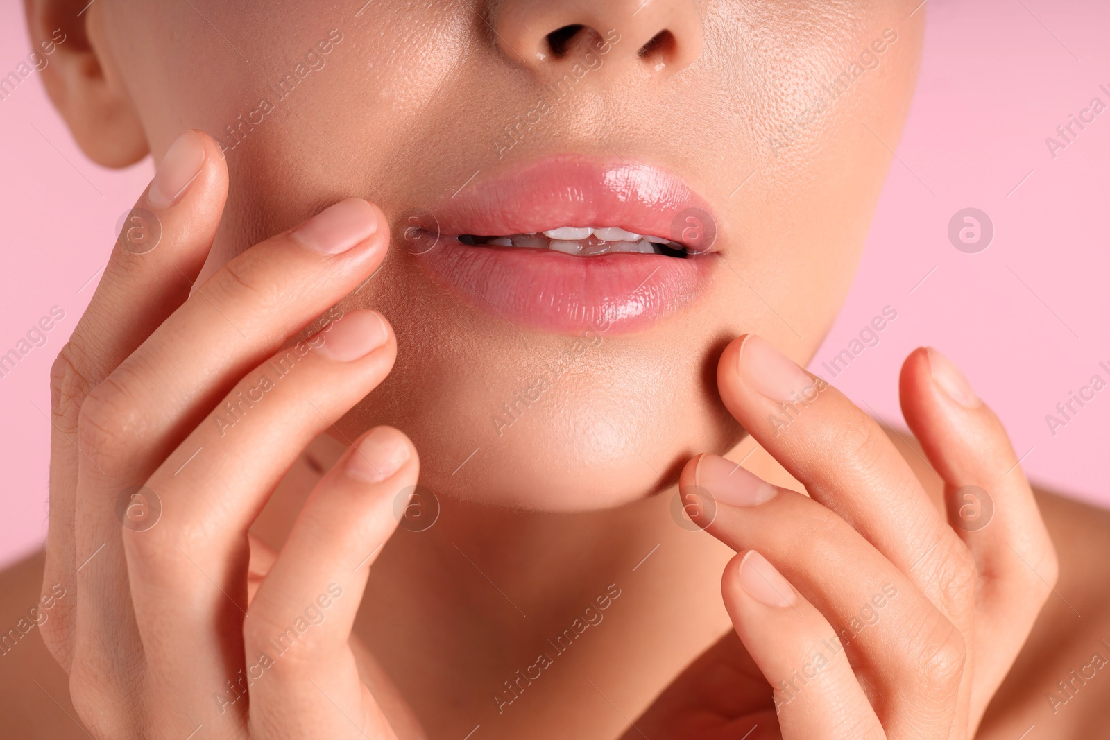 Photo of Woman with beautiful lips on pink background, macro view