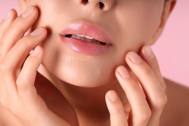 Photo of Woman with beautiful lips on pink background, macro view