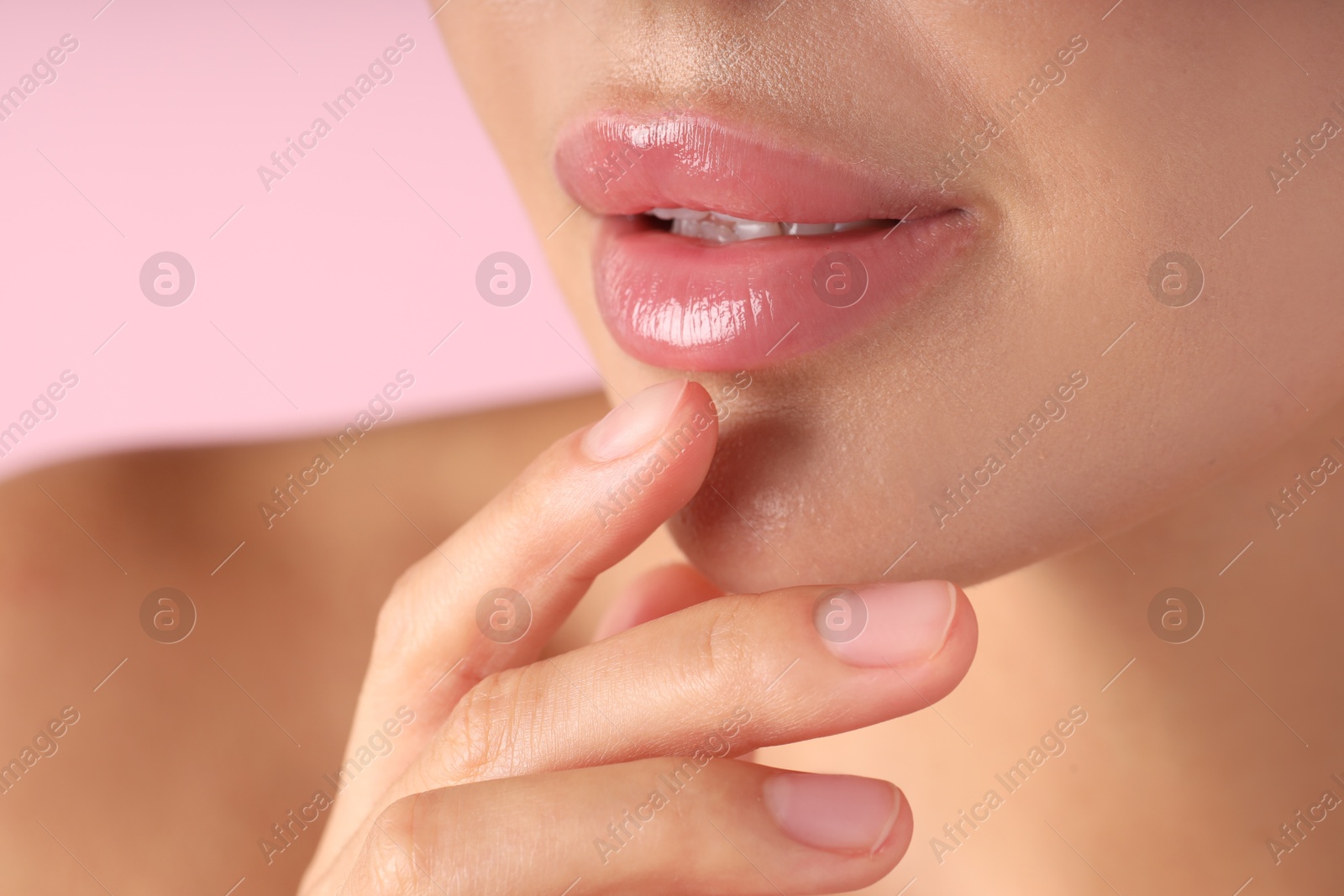Photo of Woman with beautiful lips on pink background, macro view