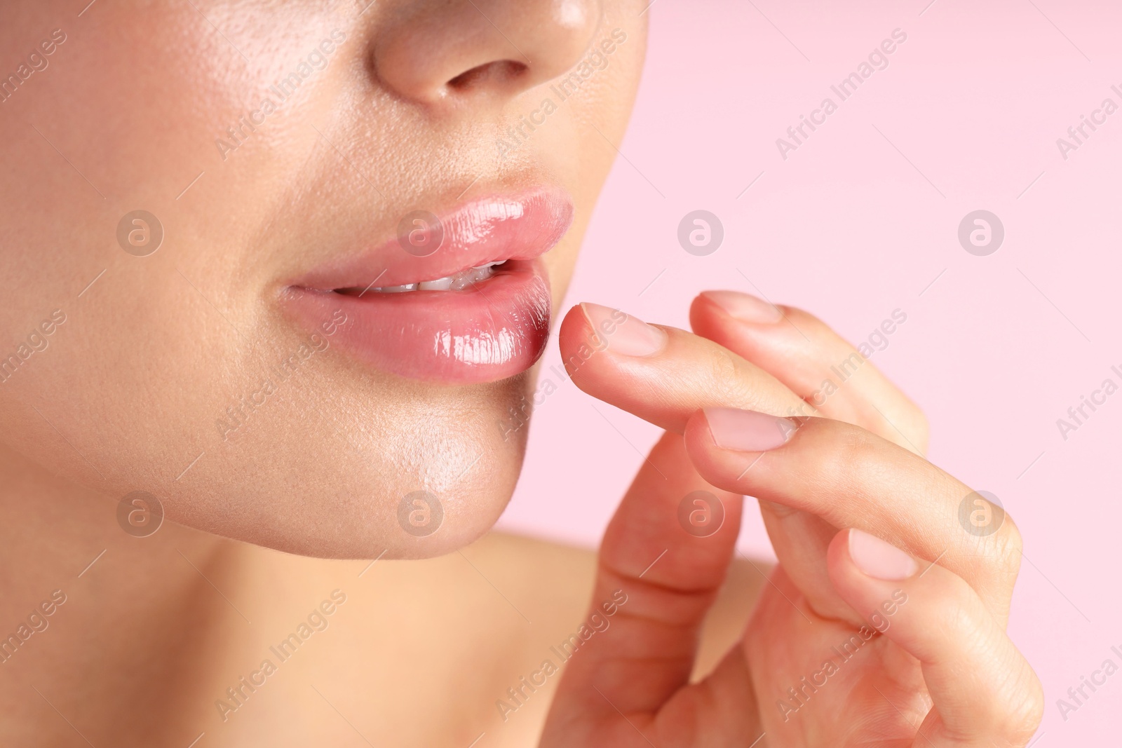 Photo of Woman with beautiful lips on pink background, macro view