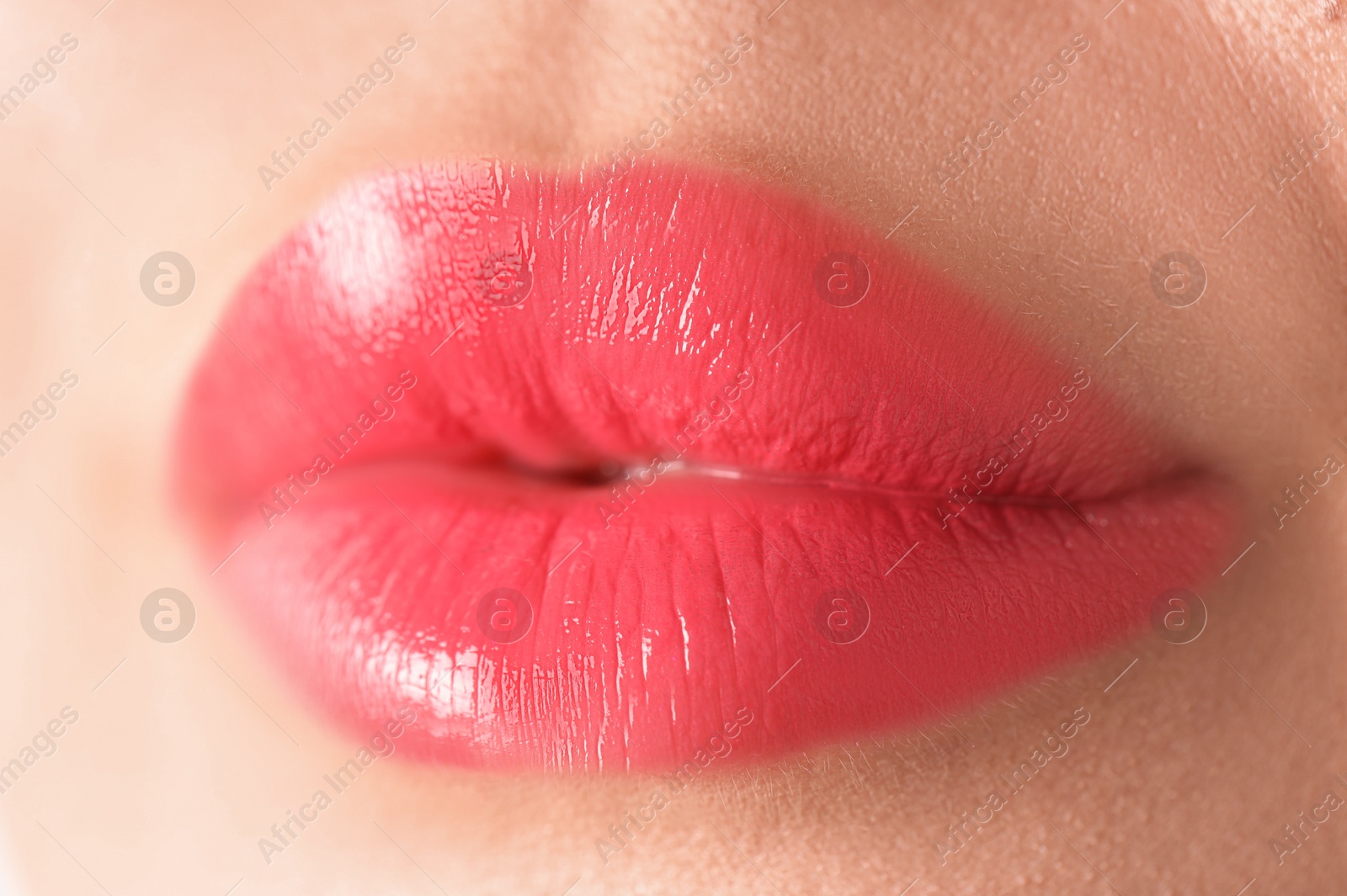 Photo of Woman with beautiful lipstick on her lips, macro view