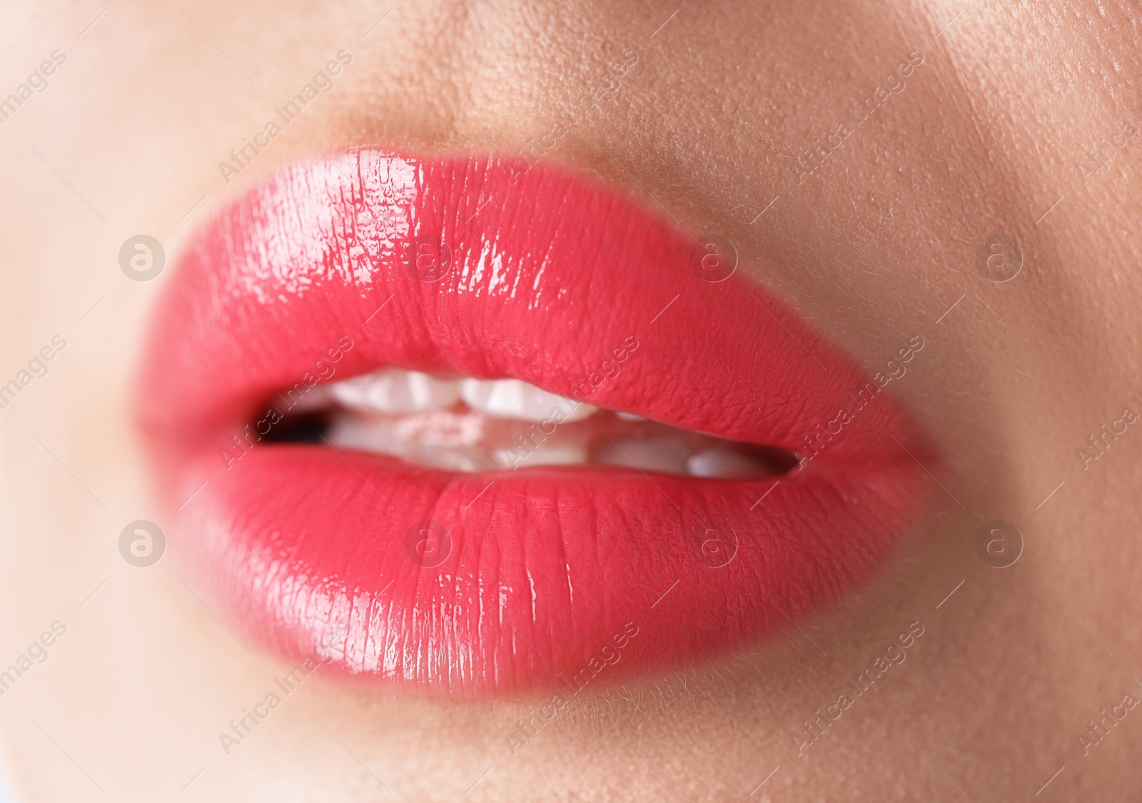 Photo of Woman with beautiful lipstick on her lips, macro view