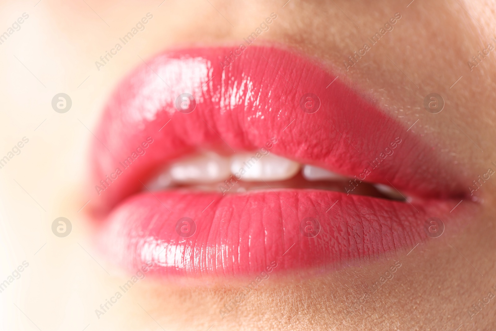 Photo of Woman with beautiful lipstick on her lips, macro view