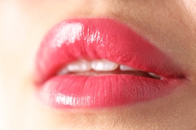 Photo of Woman with beautiful lipstick on her lips, macro view