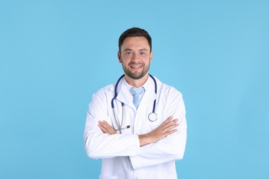 Photo of Pediatrician with stethoscope on light blue background