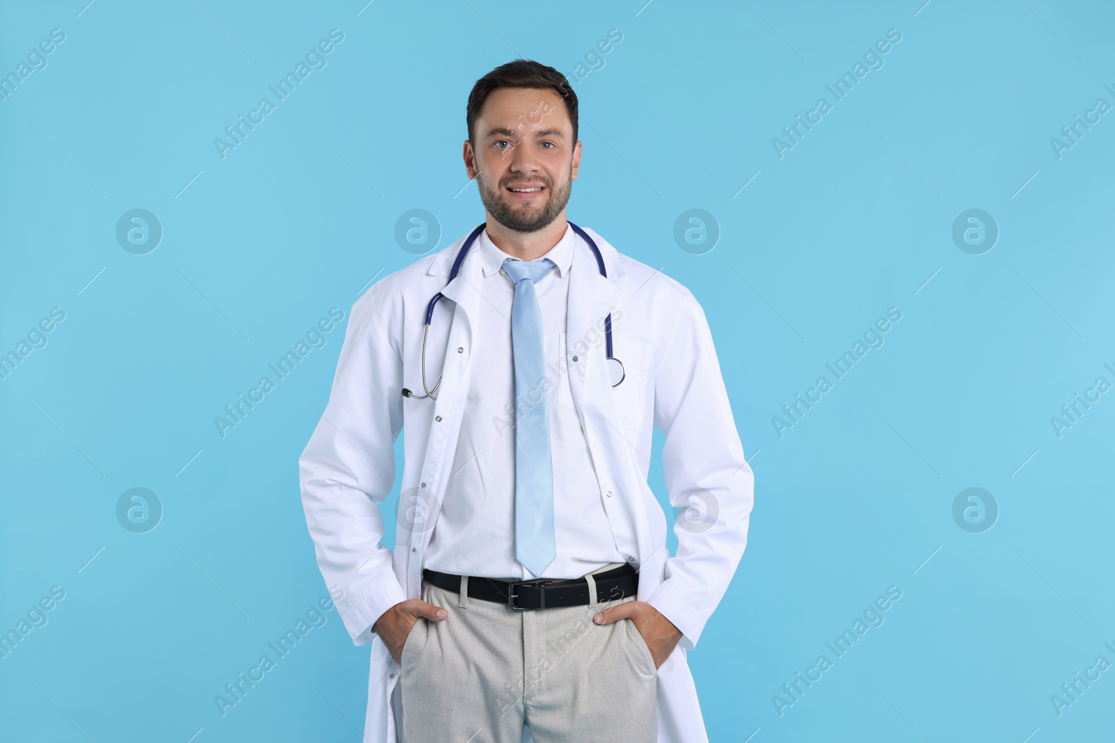 Photo of Pediatrician with stethoscope on light blue background