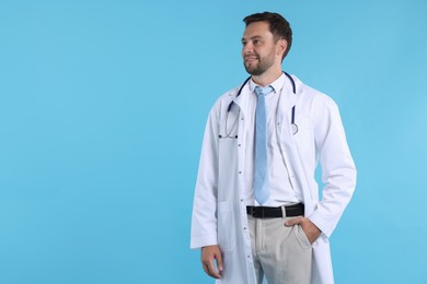 Photo of Pediatrician with stethoscope on light blue background. Space for text