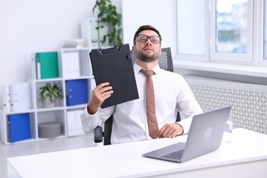 Photo of Air conditioning. Man suffering from heat at workplace in office