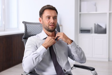Photo of Air conditioning. Man suffering from heat at workplace in office