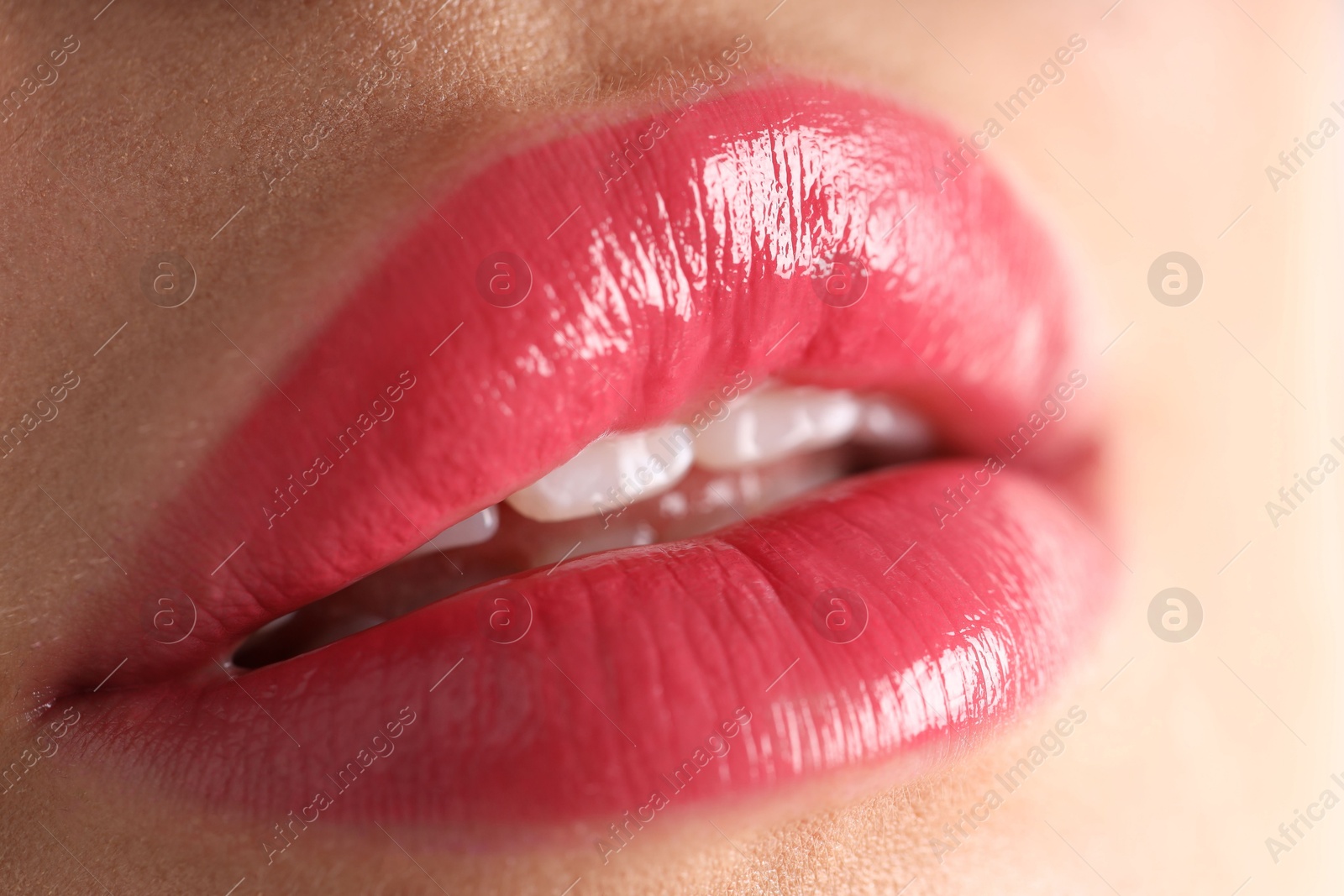 Photo of Woman with beautiful lipstick on her lips, macro view