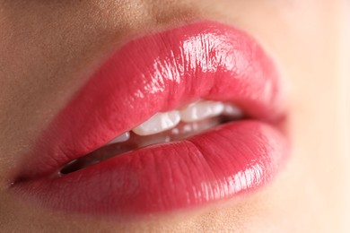 Photo of Woman with beautiful lipstick on her lips, macro view