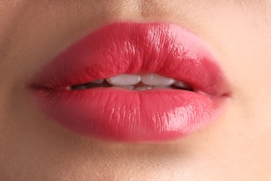Photo of Woman with beautiful lipstick on her lips, macro view