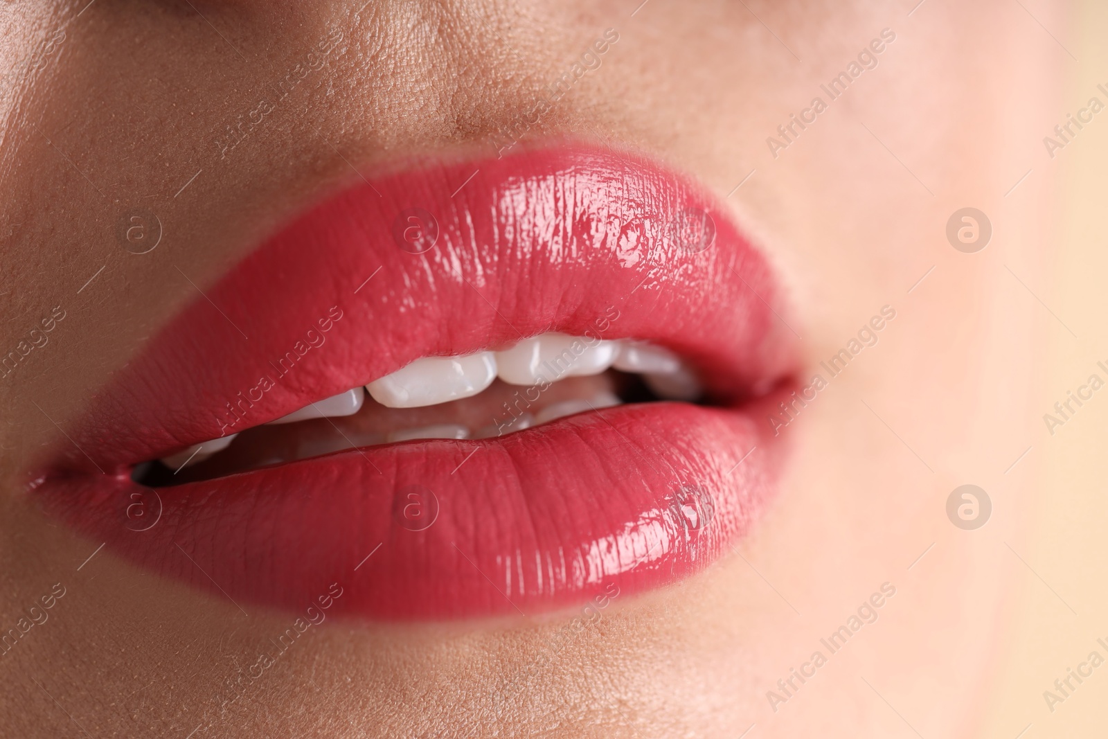 Photo of Woman with beautiful lipstick on her lips, macro view
