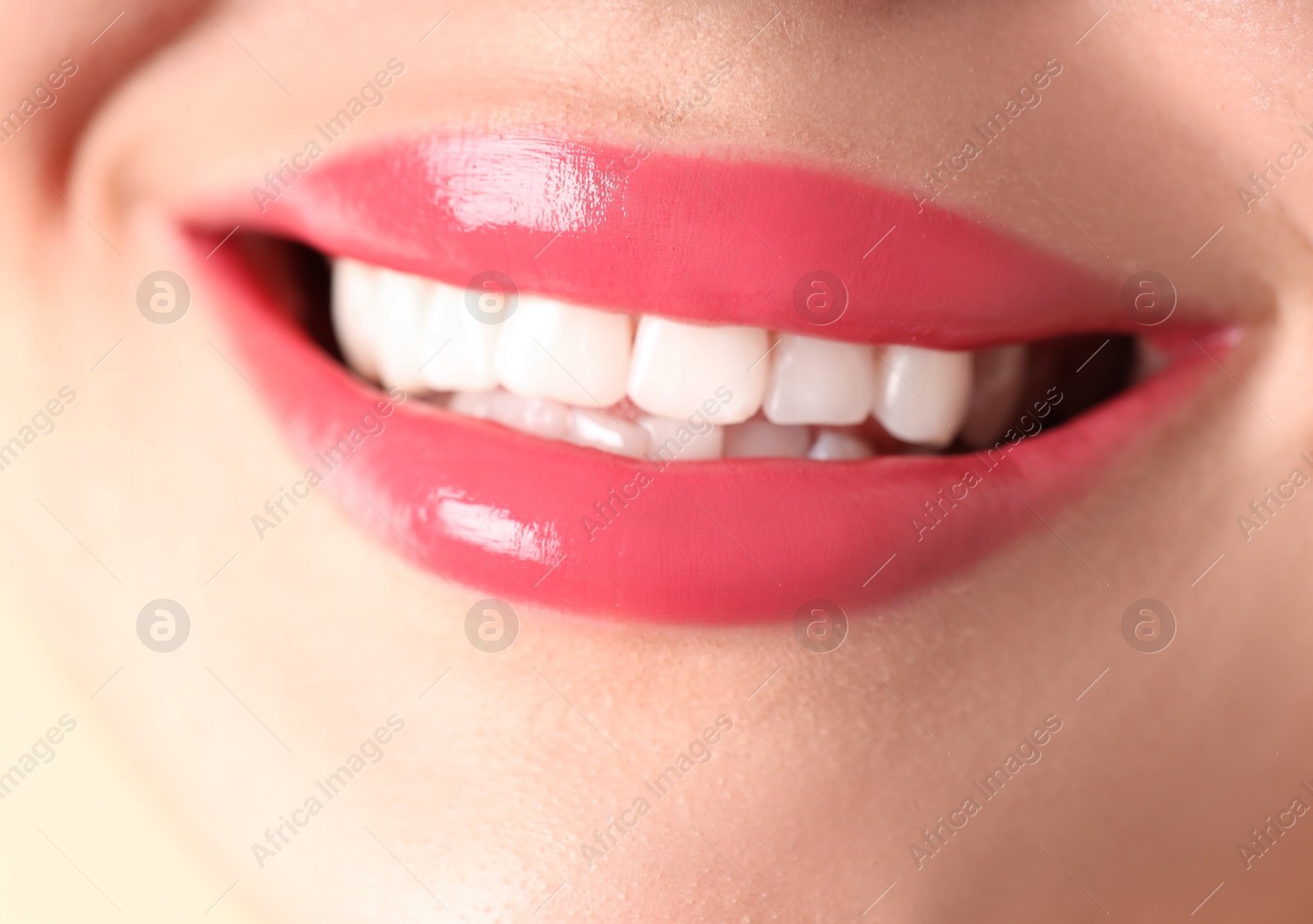 Photo of Woman with beautiful lipstick on her lips, macro view
