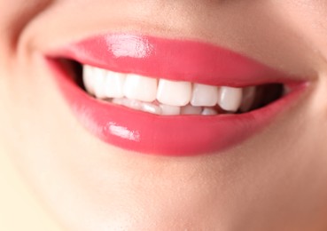 Photo of Woman with beautiful lipstick on her lips, macro view