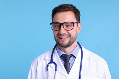 Photo of Pediatrician with stethoscope on light blue background