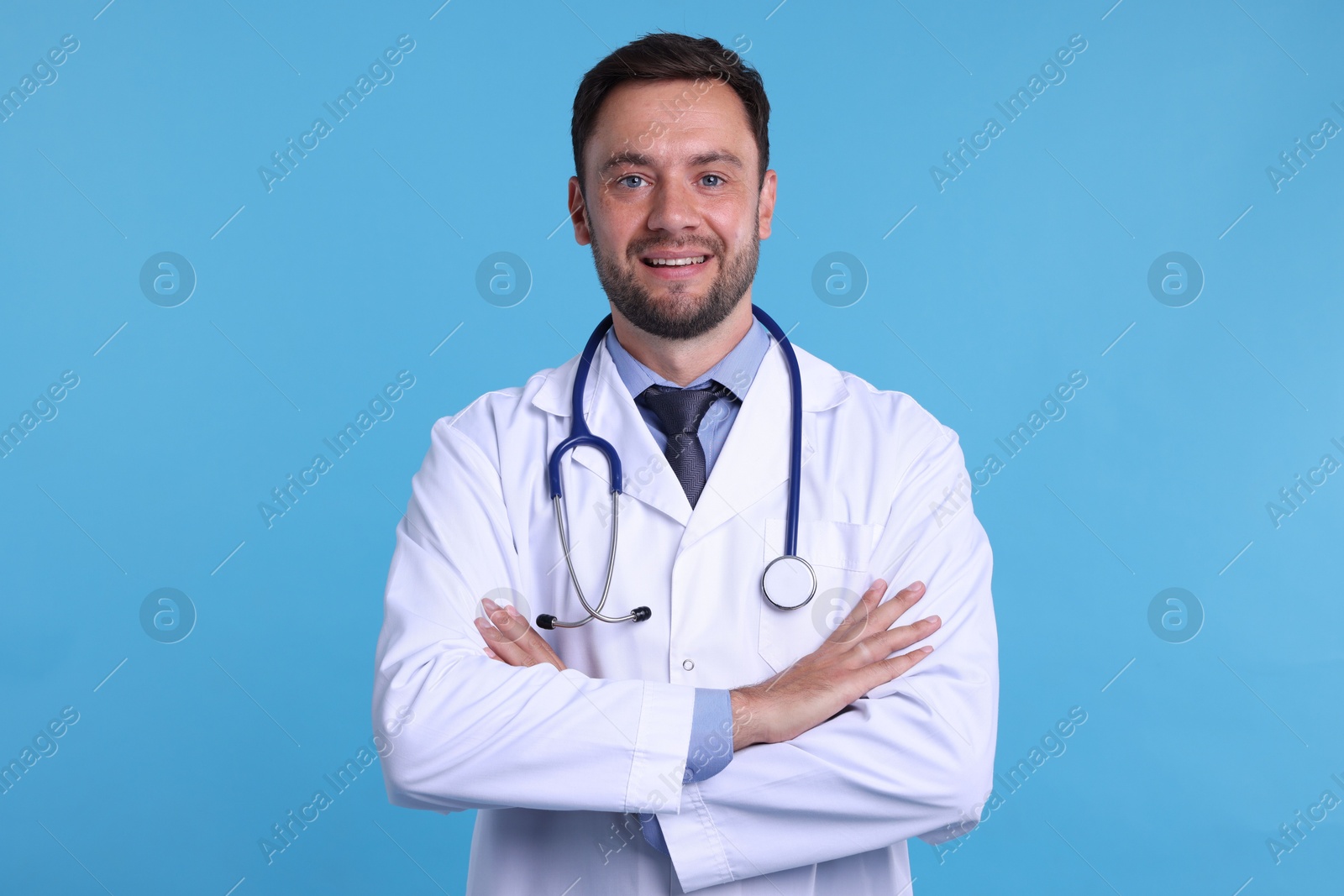 Photo of Pediatrician with stethoscope on light blue background