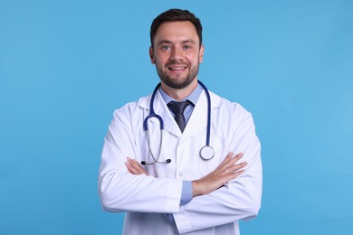 Photo of Pediatrician with stethoscope on light blue background