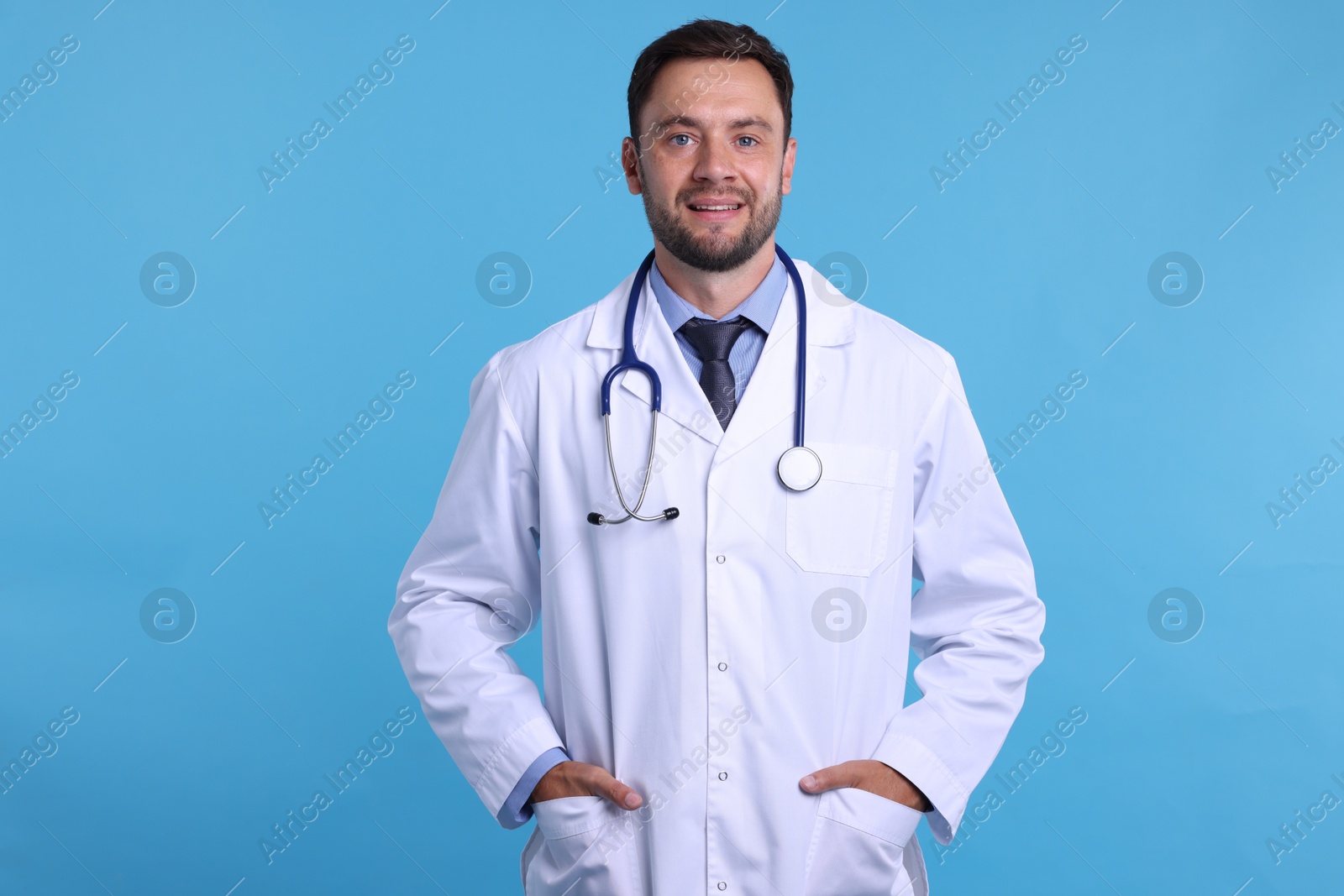 Photo of Pediatrician with stethoscope on light blue background