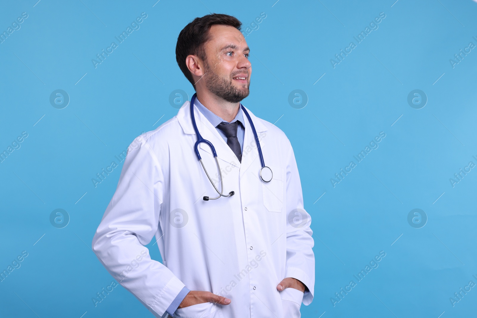 Photo of Pediatrician with stethoscope on light blue background
