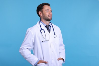 Photo of Pediatrician with stethoscope on light blue background