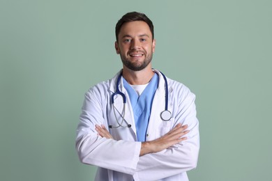 Photo of Portrait of pediatrician with stethoscope on green background