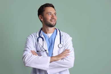 Photo of Portrait of pediatrician with stethoscope on green background
