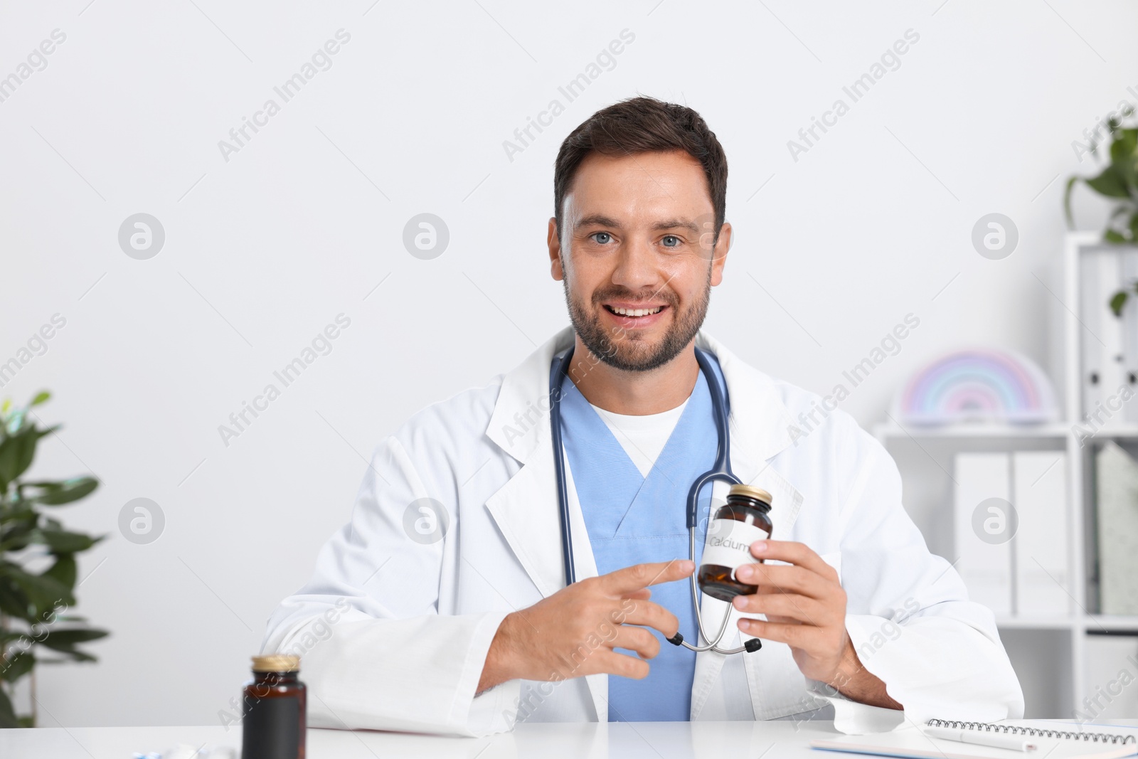 Photo of Pediatrician recommending pills during video call with patient, view from camera