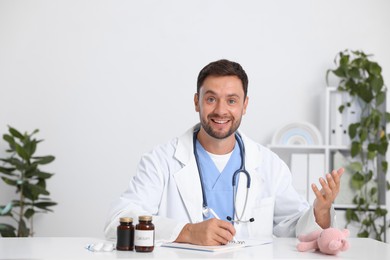 Photo of Pediatrician having video call with patient, view from camera