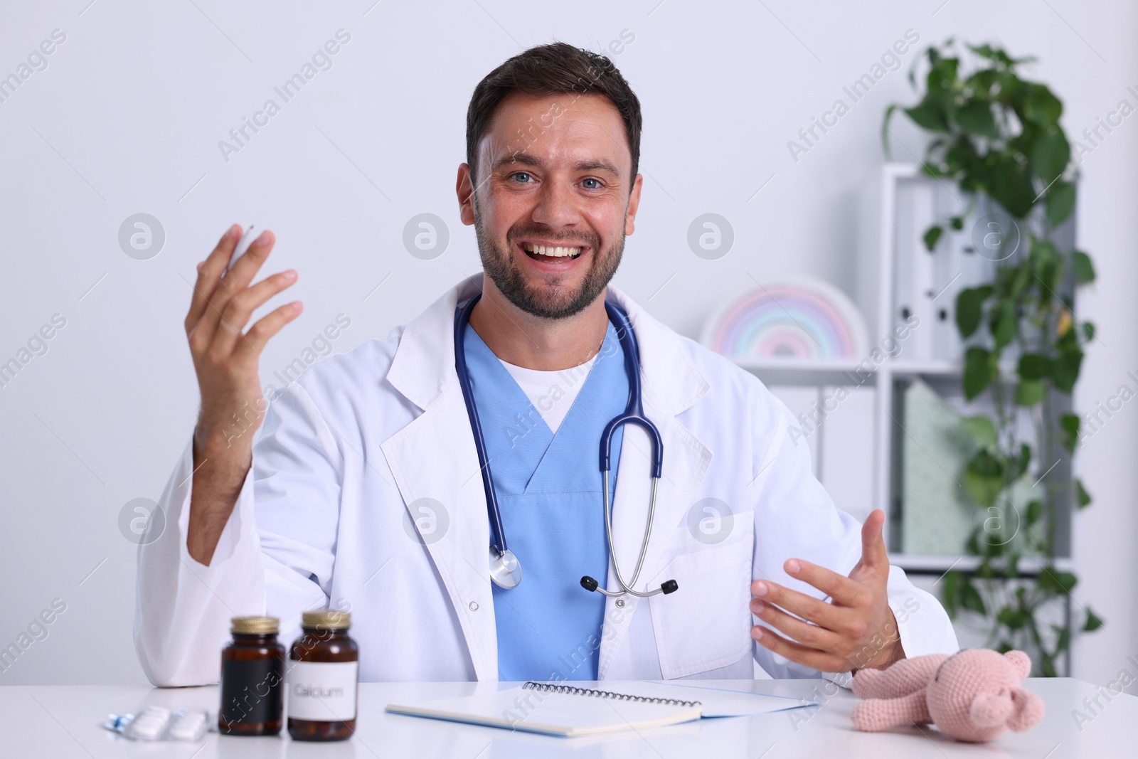Pediatrician having video call with patient, view from camera Photo of Pediatrician having video call with patient, view from camera