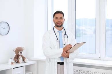 Photo of Pediatrician with stethoscope and clipboard in hospital